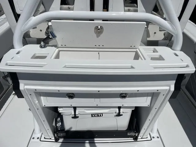 Slide: The Image of 2023 Blackfin 272CC center console with Yeti cooler and storage compartments. - 5