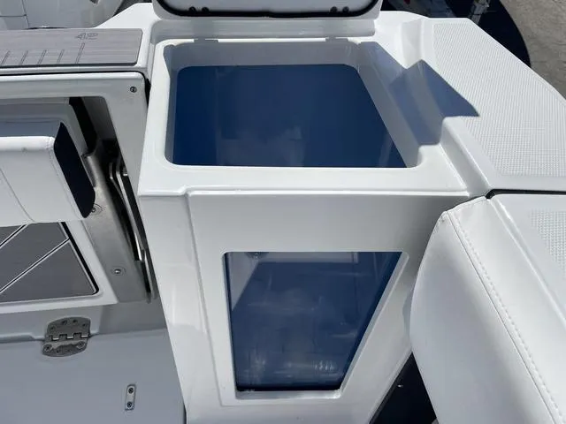 Slide: The Image of 2023 Blackfin 272CC boat interior detail with storage compartment. - 7