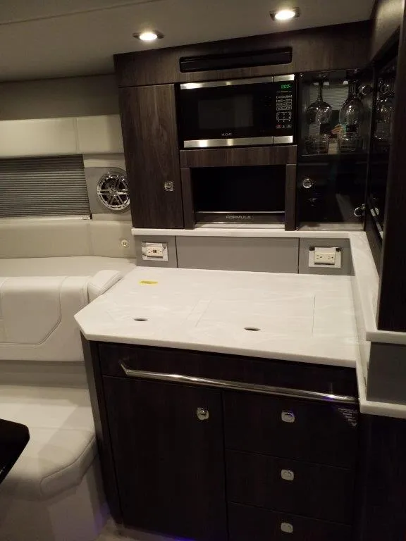 Slide: The Image of 2020 Formula 430 All Sport Crossover yacht interior kitchen with modern appliances. - 12