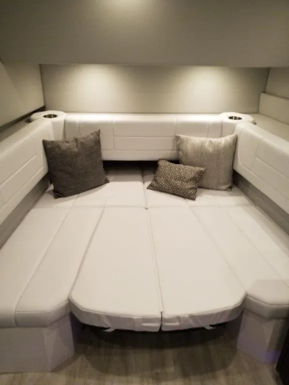 Slide: The Image of 2020 Formula 430 All Sport Crossover interior cabin with white seating and cushions. - 14