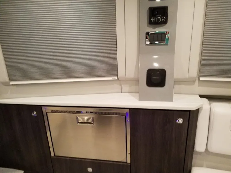 Slide: The Image of 2020 Formula 430 All Sport Crossover interior with modern appliances and control panel. - 15