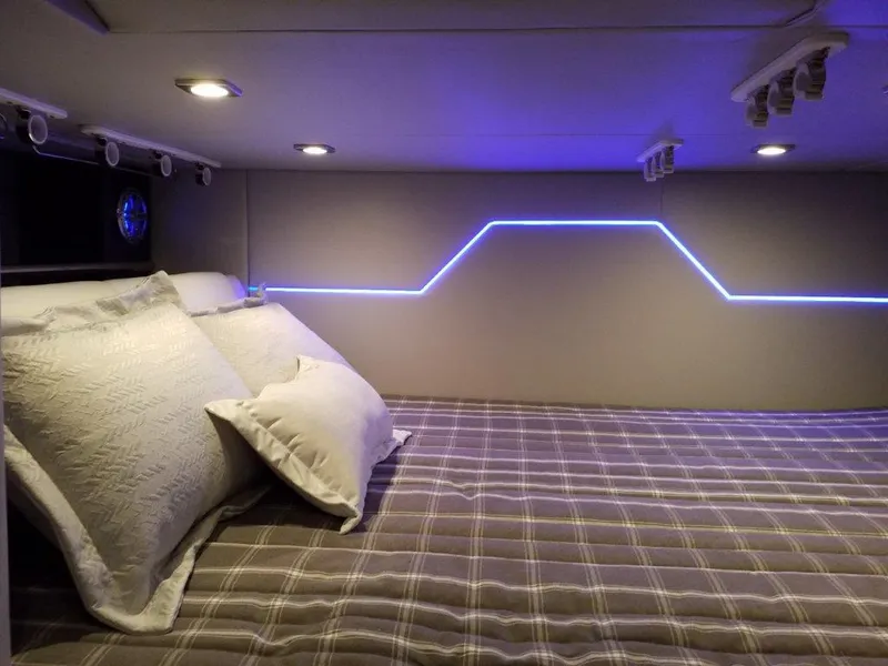 Slide: The Image of 2020 Formula 430 All Sport Crossover cabin with modern LED lighting and cozy bedding. - 20