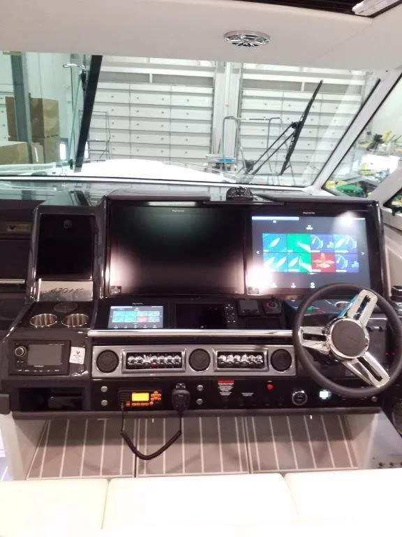 Slide: The Image of 2020 Formula 430 All Sport Crossover boat dashboard with advanced navigation and control systems. - 23