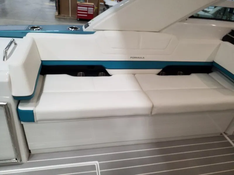 Slide: The Image of 2020 Formula 430 All Sport Crossover boat interior with white and blue seating. - 27