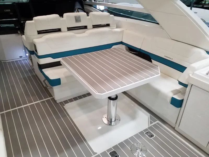 Slide: The Image of 2020 Formula 430 All Sport Crossover boat interior with seating and table. - 28