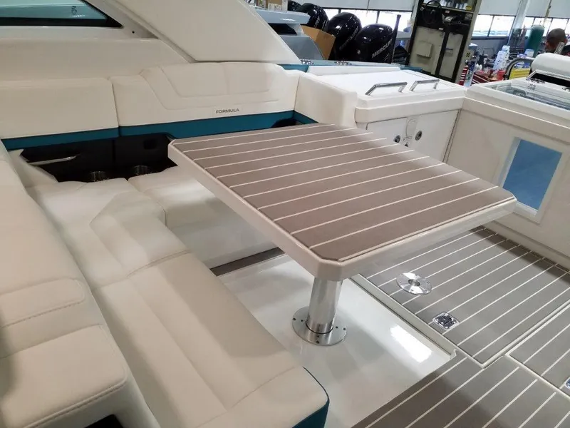 Slide: The Image of 2020 Formula 430 All Sport Crossover boat interior with seating and table. - 29