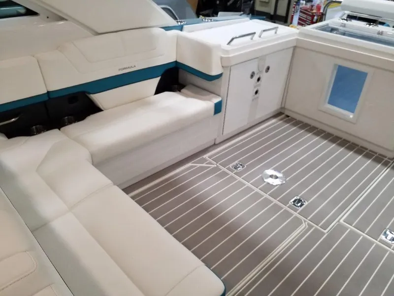 Slide: The Image of 2020 Formula 430 All Sport Crossover boat interior with white and blue seating. - 30