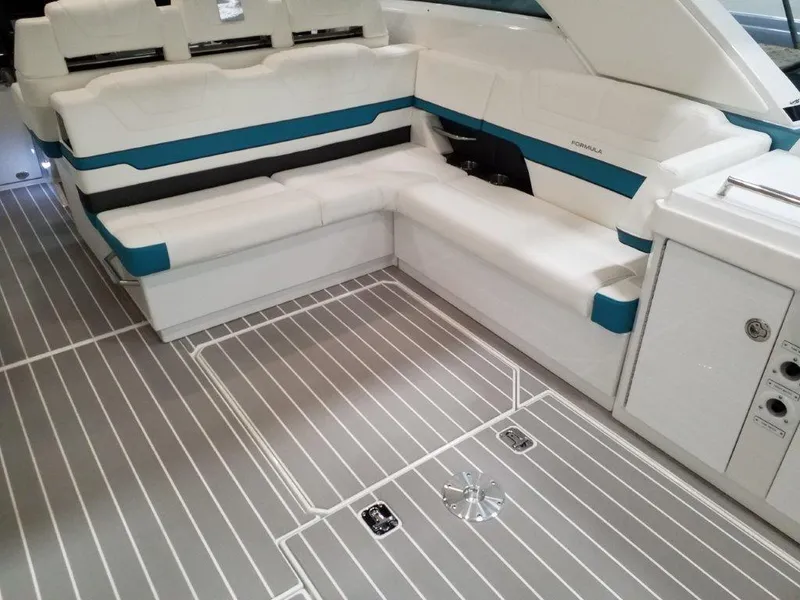 Slide: The Image of 2020 Formula 430 All Sport Crossover boat interior with white and teal seating. - 31