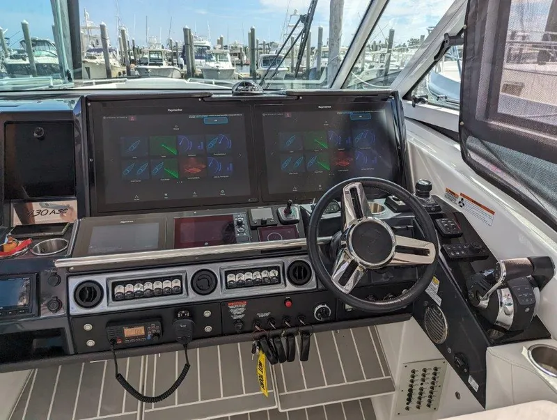 Slide: The Image of 2020 Formula 430 All Sport Crossover helm with dual displays and advanced controls. - 34