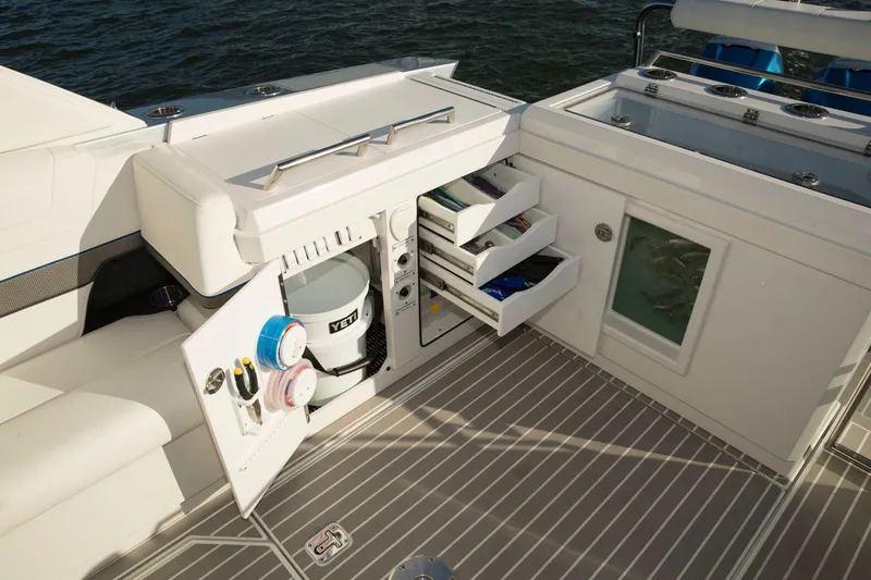 Slide: The Image of 2020 Formula 430 All Sport Crossover boat interior with storage compartments and equipment. - 39