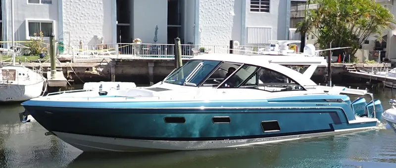 Slide: The Image of 2020 Formula 430 All Sport Crossover boat docked in a marina. - 4