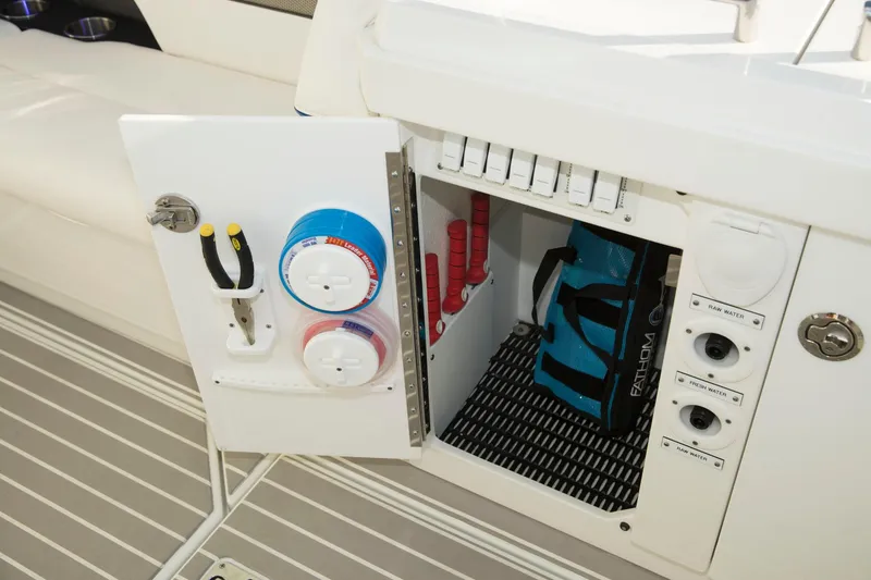 Slide: The Image of Storage compartment on a 2020 Formula 430 All Sport Crossover boat with tools and equipment. - 40