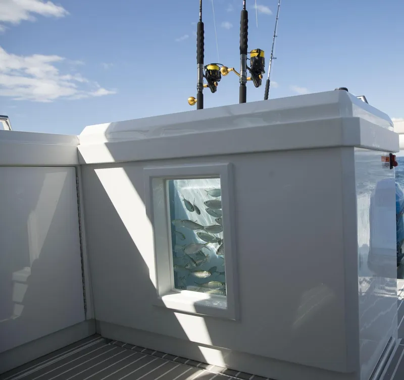 Slide: The Image of 2020 Formula 430 All Sport Crossover fishing boat with live bait tank and fishing rods. - 41