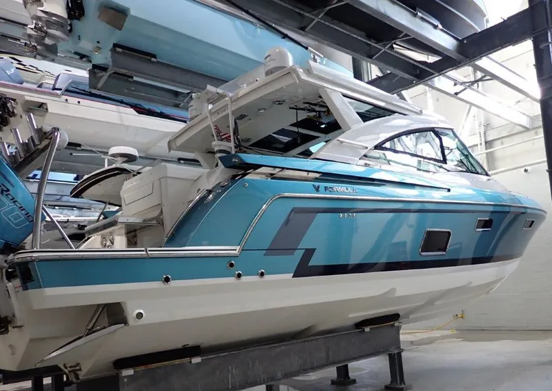 Slide: The Image of 2020 Formula 430 All Sport Crossover boat in a showroom. - 7