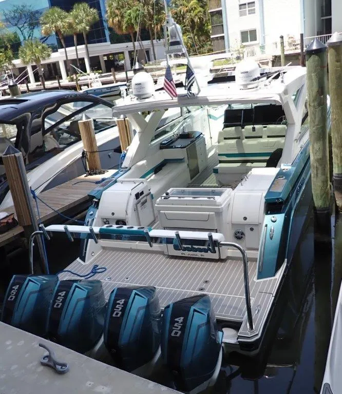 Slide: The Image of 2020 Formula 430 All Sport Crossover boat docked at a marina. - 8