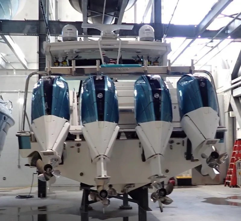 Slide: The Image of 2020 Formula 430 All Sport Crossover with four outboard engines in a boatyard. - 9