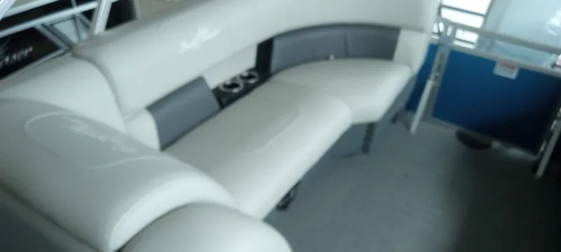 Slide: The Image of 2024 SunChaser Vista 22 LR boat interior with white and gray seating. - 10