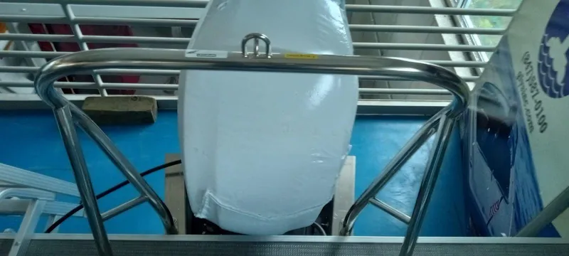 Slide: The Image of 2024 SunChaser Vista 22 LR boat engine covered in protective wrap. - 11