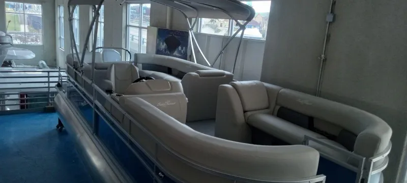 Slide: The Image of 2024 SunChaser Vista 22 LR pontoon boat with spacious seating and canopy. - 12