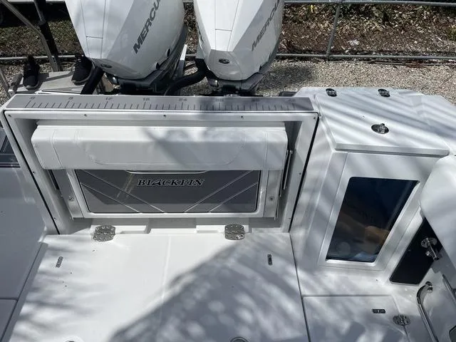 Slide: The Image of 2023 Blackfin 272CC boat with Mercury engines and foldable seating. - 15