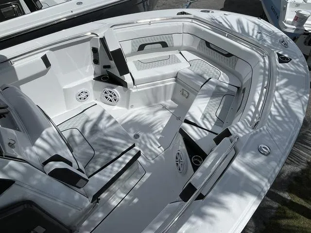Slide: The Image of 2023 Blackfin 272CC boat interior with seating and speakers. - 19