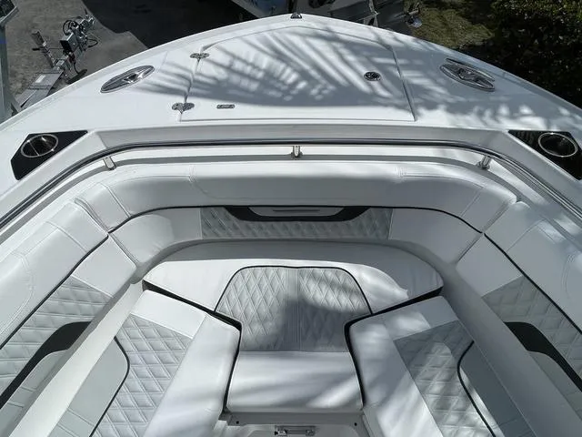 Slide: The Image of 2023 Blackfin 272CC boat with luxurious white seating and diamond-stitched upholstery. - 21