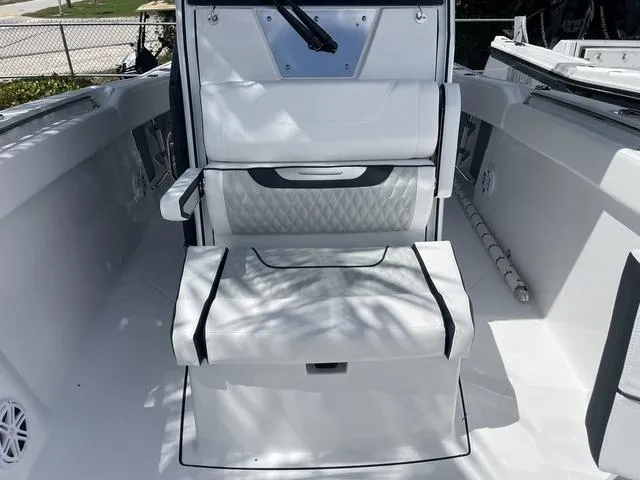 Slide: The Image of 2023 Blackfin 272CC boat interior with white seating and modern design. - 25