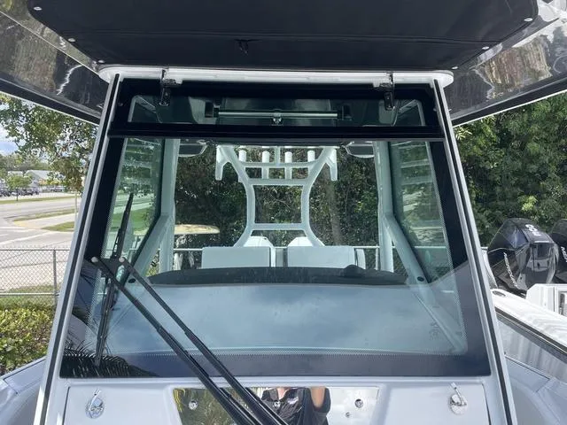Slide: The Image of 2023 Blackfin 272CC boat windshield and console view. - 27
