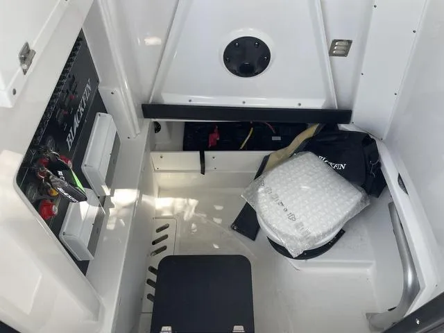 Slide: The Image of 2023 Blackfin 272CC boat interior storage and control panel. - 28