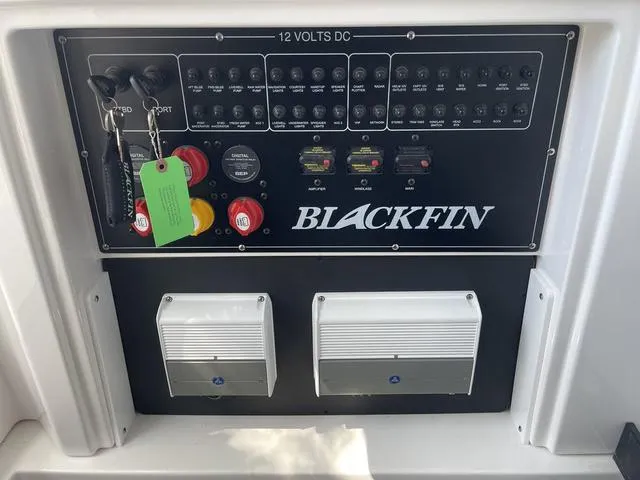 Slide: The Image of 2023 Blackfin 272CC control panel with switches and indicators. - 29