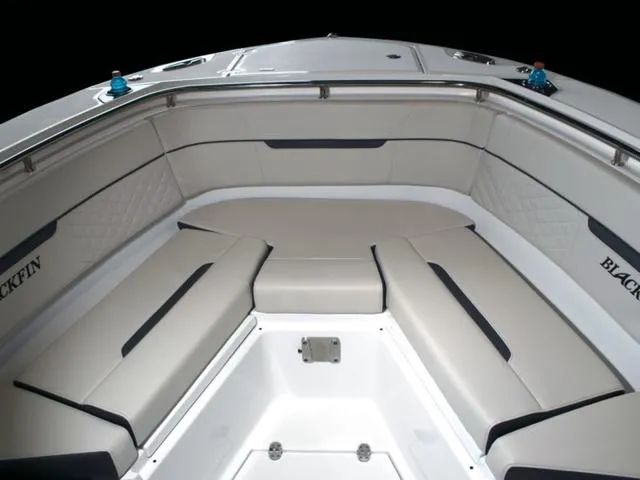 Slide: The Image of 2023 Blackfin 272CC boat interior with cushioned seating and stainless steel railings. - 31