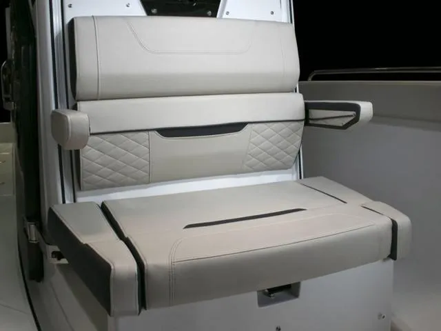 Slide: The Image of 2023 Blackfin 272CC boat seating with cushioned backrest and armrests. - 32
