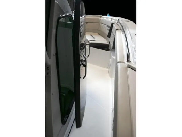 Slide: The Image of 2023 Blackfin 272CC boat interior with open door and seating area. - 38