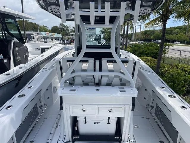 Slide: The Image of 2023 Blackfin 272CC center console boat with Yeti cooler and rod holders. - 5