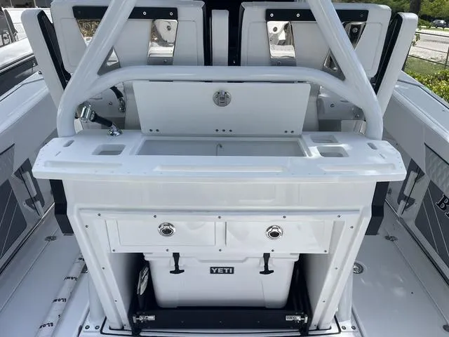 Slide: The Image of 2023 Blackfin 272CC center console with Yeti cooler and storage compartments. - 6