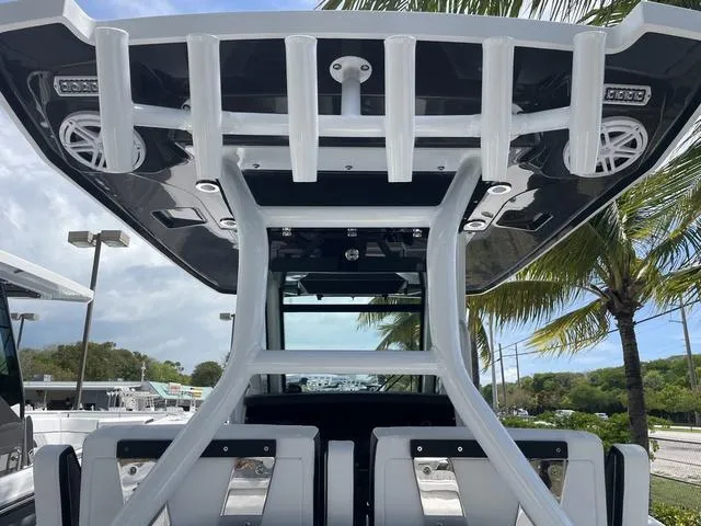 Slide: The Image of 2023 Blackfin 272CC center console boat with T-top and rod holders. - 7