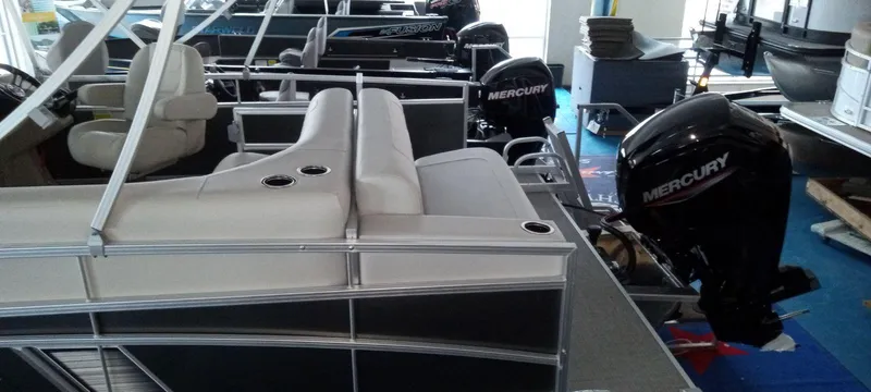 Slide: The Image of 2024 SunChaser Vista 20 CRB pontoon boat with Mercury outboard motor. - 2