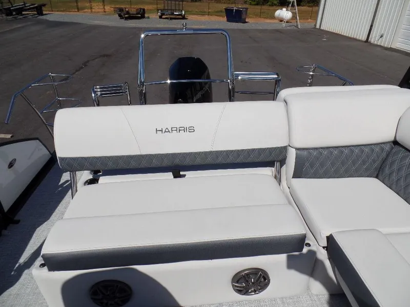 Slide: The Image of 2024 Harris Sunliner 230 boat interior with white and gray seating. - 13