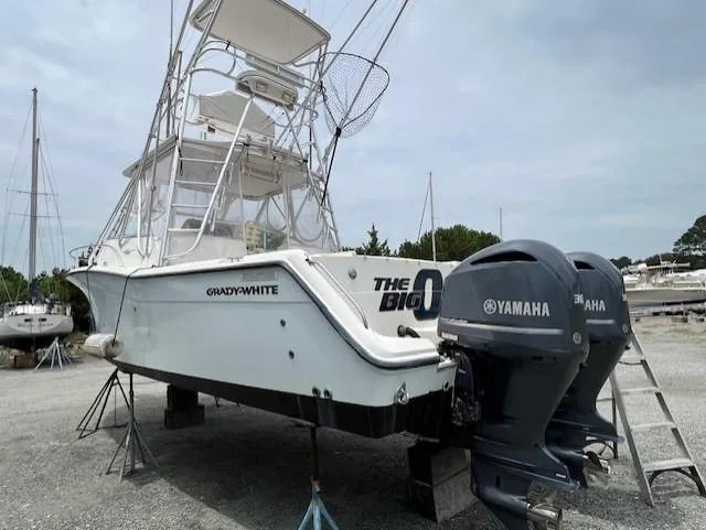 Slide: The Image of 2002 Grady-White 330 Express boat with Yamaha engines on dry dock. - 35