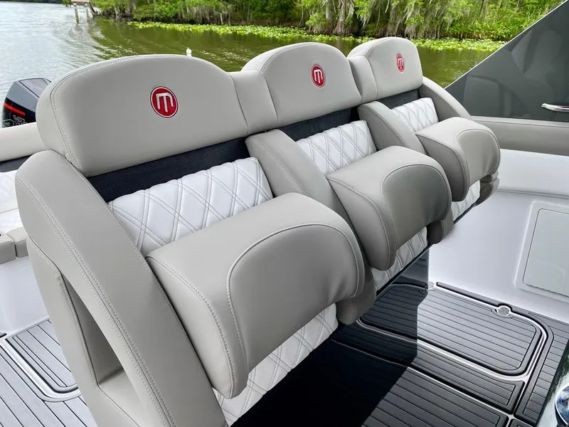 Slide: The Image of Luxurious seating on 2020 Mystic Powerboats M4200, featuring elegant design and premium materials. - 13