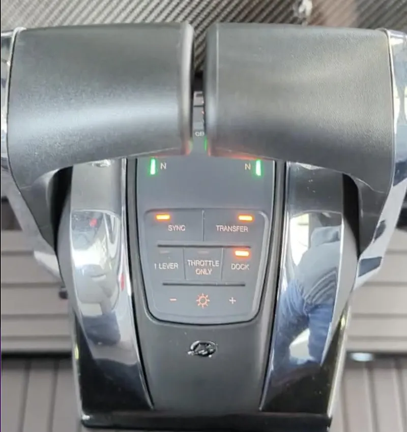 Slide: The Image of Throttle controls of a 2020 Mystic Powerboats M4200, featuring various operational buttons. - 19