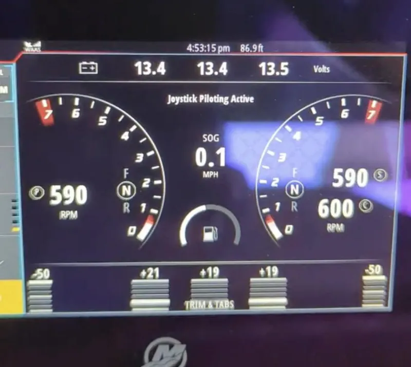 Slide: The Image of Dashboard of a 2020 Mystic Powerboats M4200 showing RPM, voltage, and joystick piloting status. - 21