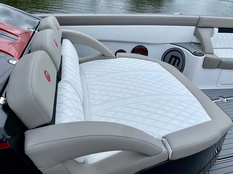Slide: The Image of Luxurious seating on 2020 Mystic Powerboats M4200, featuring elegant white and beige upholstery. - 27
