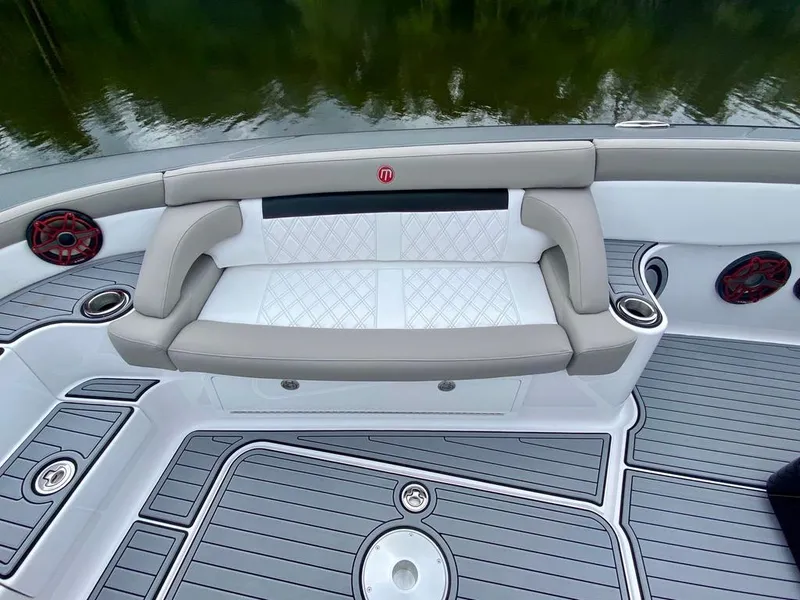 Slide: The Image of 2020 Mystic Powerboats M4200 interior with cushioned seating and sleek design. - 33