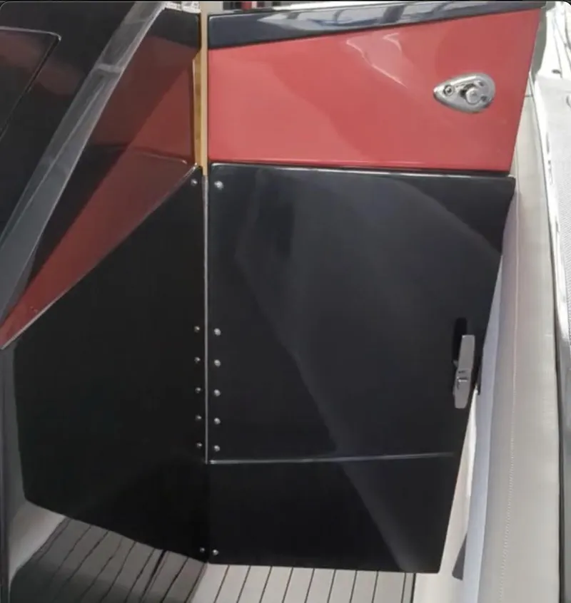 Slide: The Image of 2020 Mystic Powerboats M4200, sleek black and red exterior detail. - 35