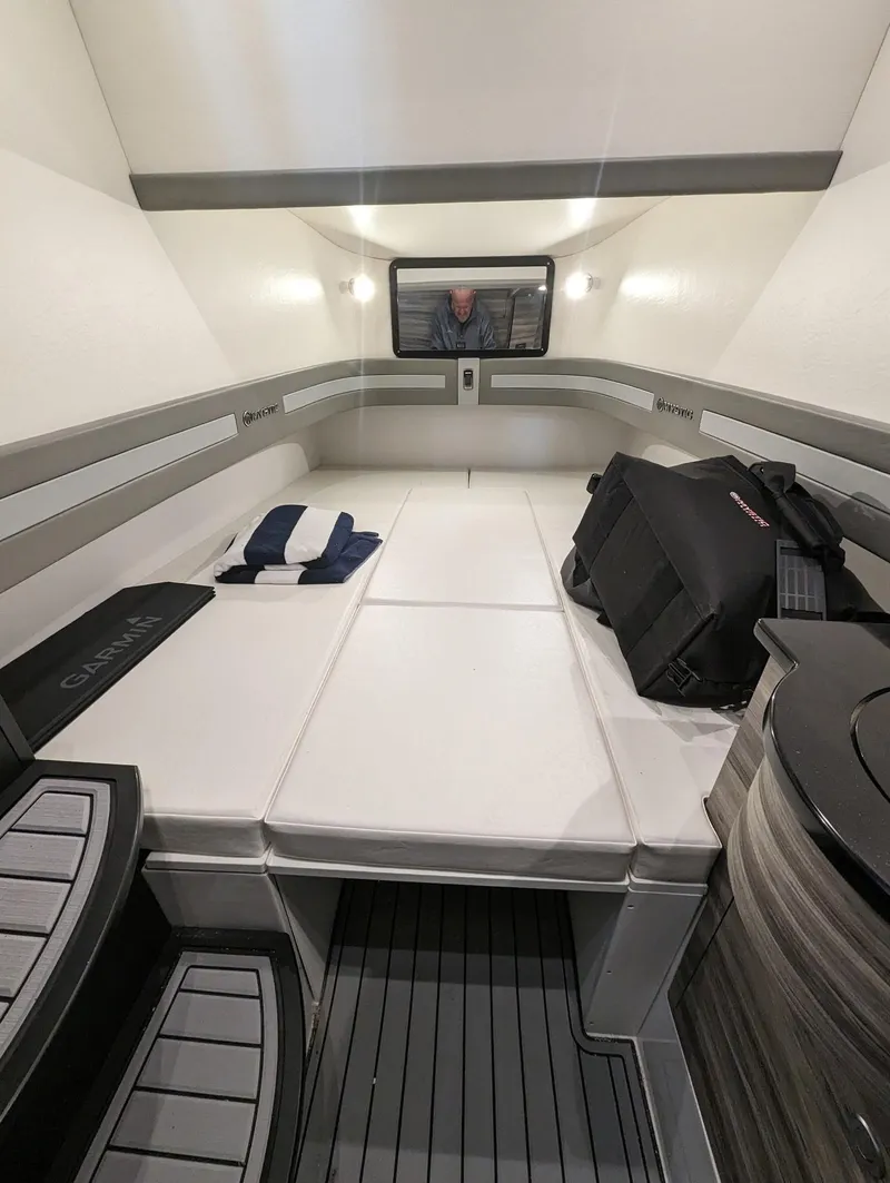 Slide: The Image of Interior cabin of 2020 Mystic Powerboats M4200 with modern seating and storage. - 39