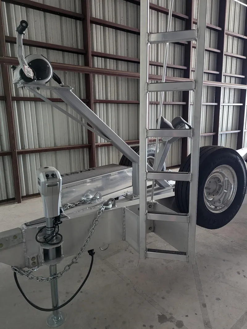 Slide: The Image of Trailer for 2020 Mystic Powerboats M4200, featuring sturdy metal frame and wheel in storage. - 48