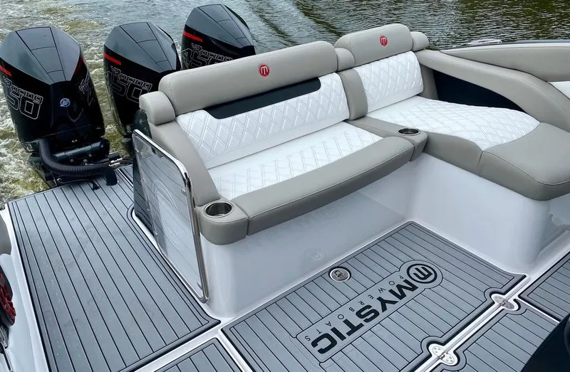 Slide: The Image of 2020 Mystic Powerboats M4200 with luxurious seating and powerful outboard engines. - 9