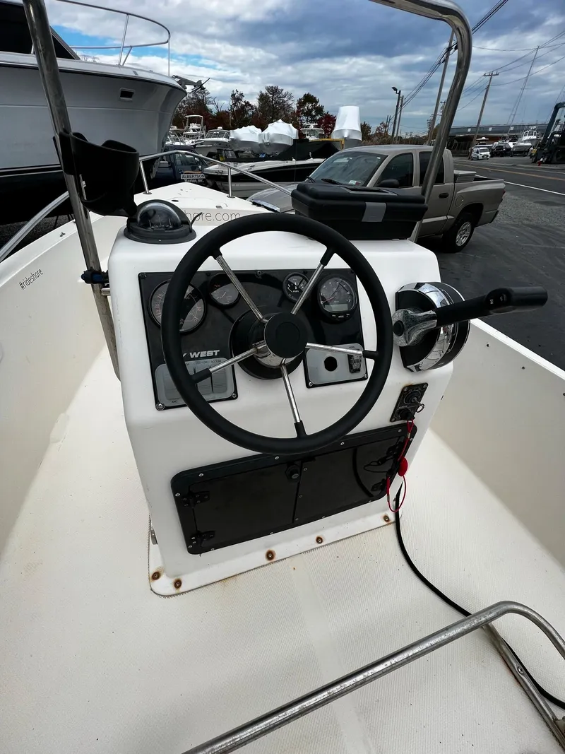 Slide: The Image of Steering console of a 2002 Key West 1720 Center Console boat. - 12