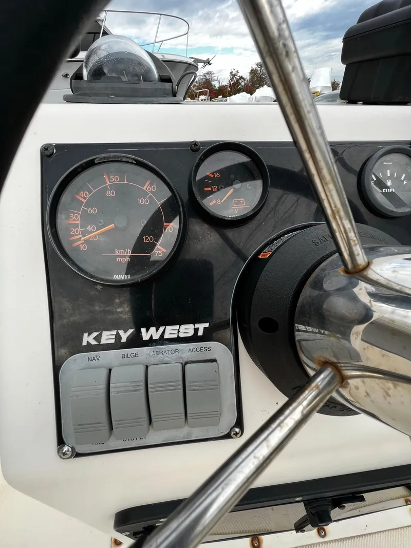 Slide: The Image of Dashboard of a 2002 Key West 1720 Center Console boat. - 13